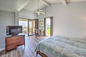 a bedroom with a bed and a flat screen tv at Hanalei Bay Resort 8234 in Princeville