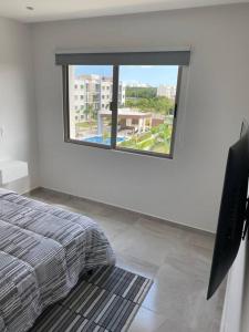 Ένα ή περισσότερα κρεβάτια σε δωμάτιο στο Amazing Condo with great Pool and 24/7 security