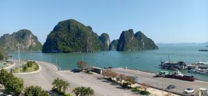 a view of a harbor with mountains in the water at Tropical Villa Halong in Ha Long