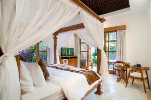 TV a/nebo společenská místnost v ubytování Danakha Villa Ubud