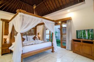 TV a/nebo společenská místnost v ubytování Danakha Villa Ubud