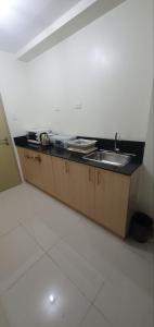 a kitchen with a sink and a counter at 05-06 at Wind Residences Tagaytay in Tagaytay