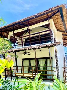 a villa with a view of a house at Siargao Island Villas in General Luna