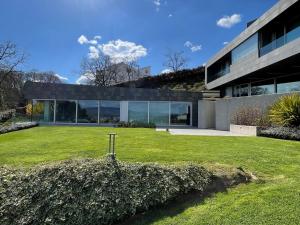 an exterior view of a house with a yard at Tres Prismas Exclusive in Sarria