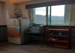 Kuhinja ili čajna kuhinja u objektu Happiness Homestay