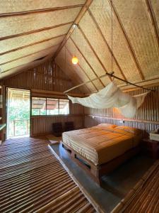 Ένα ή περισσότερα κρεβάτια σε δωμάτιο στο Bamboo Hideaway Resort