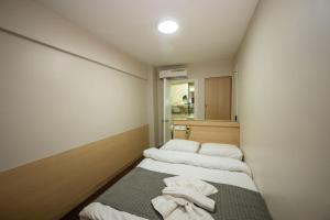 Postel nebo postele na pokoji v ubytování Hotel Melita