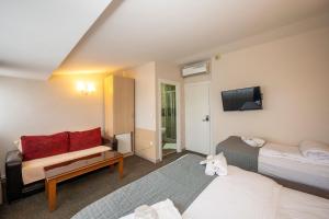 Postel nebo postele na pokoji v ubytování Hotel Melita