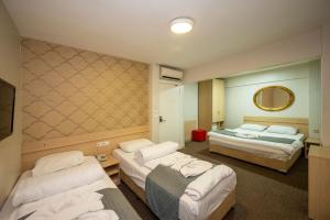Postel nebo postele na pokoji v ubytování Hotel Melita