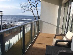a balcony with a view of the ocean at Apartment SEA VIEW Ustronie Morskie in Ustronie Morskie