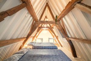 a room with two beds in a attic at The Hendrik Square Apartments in Antwerp