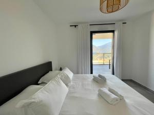 Postel nebo postele na pokoji v ubytování APPART-NEUF-VUE MER- 6 PERS