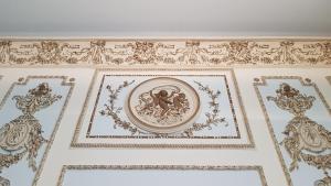 a ceiling with ornate ceilings in a building at Hotel Grand'Italia in Padova