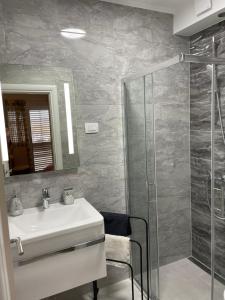 a bathroom with a sink and a shower at Apartments Miriam Srima in Vodice +74 photos
