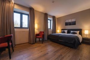Ένα ή περισσότερα κρεβάτια σε δωμάτιο στο Hotel Monvillage