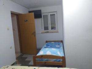 Postel nebo postele na pokoji v ubytování Apartmani Branka