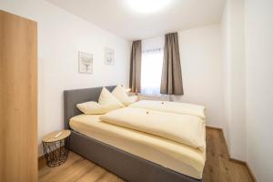 Postel nebo postele na pokoji v ubytování Haus Kindler