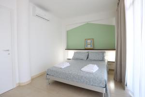 Posteľ alebo postele v izbe v ubytovaní Affittacamere Aria Di Mare