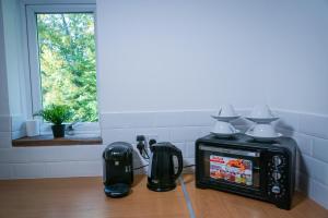 a kitchen with a tea kettle and a blender at Central studio in quiet area in Newbury