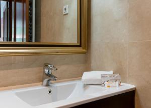 a bathroom with a sink and a mirror at Zubia apartment by People Rentals in Bilbao +21 photos