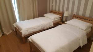 Postel nebo postele na pokoji v ubytování Villa Luxury Rooms - Wine Resort