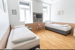 Posteľ alebo postele v izbe v ubytovaní Comfortable Apartments Vienna 1100 with contactless Check-in