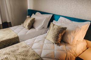 Letto o letti in una camera di Dock 1 Boutique Hotel
