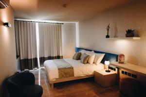 Letto o letti in una camera di Dock 1 Boutique Hotel