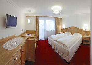 Postel nebo postele na pokoji v ubytování Hotel Ingram