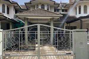 a gate in front of a house at JML Family Homestay ~ Entire Residential Home in Kota Kinabalu