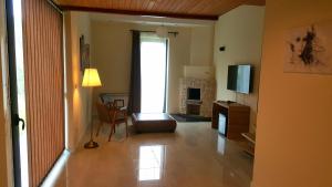 TV a/nebo společenská místnost v ubytování Villa Luxury Rooms - Wine Resort