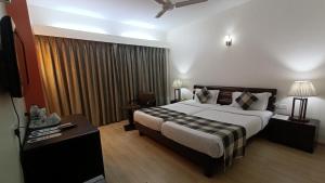 Cama o camas de una habitación en Inventree hotels & Resort