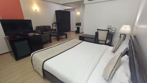 Cama o camas de una habitación en Inventree hotels & Resort