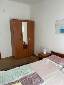 Postel nebo postele na pokoji v ubytování Apartment E&M