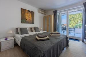 Postel nebo postele na pokoji v ubytování Apartment Vito