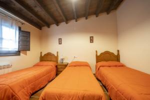 A bed or beds in a room at RuralEcofilabres