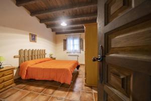 A bed or beds in a room at RuralEcofilabres