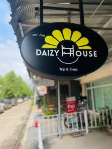 a daisy house sign on the side of a building at Daizy House in Chiang Mai