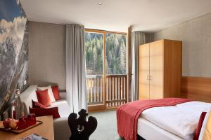 Voodi või voodid majutusasutuse Hotel Ortles B&B toas
