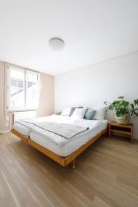 Hotel Untertor by Maier - Self-Check-in客房内的一张或多张床位