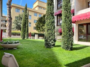 Vonkajšia záhrada v ubytovaní Gemelli Hotel