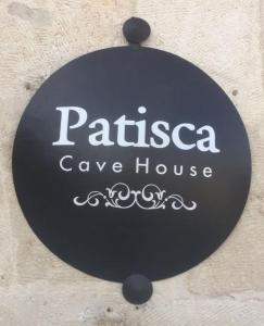 a sign for a cave house on a building at patisca cave house in cappadocia in Urgup