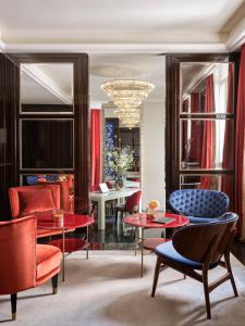 a living room with red and blue furniture and a chandelier at Vista Palazzo in Verona
