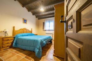 A bed or beds in a room at RuralEcofilabres Még 37 kép