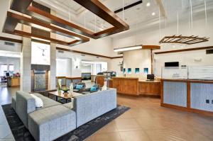 a living room with a couch and a table at Hyatt Place Las Vegas in Las Vegas