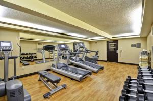 a gym with treadmills and ellipticals in a room at Hyatt Place Las Vegas in Las Vegas