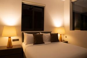 Llit o llits en una habitació de Crystal Sands Hikkaduwa