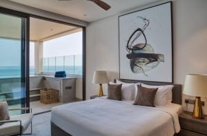 Llit o llits en una habitació de Crystal Sands Hikkaduwa