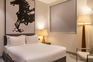 Llit o llits en una habitació de Crystal Sands Hikkaduwa