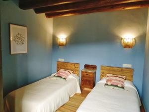 Ένα ή περισσότερα κρεβάτια σε δωμάτιο στο Casa Serra de Dalt